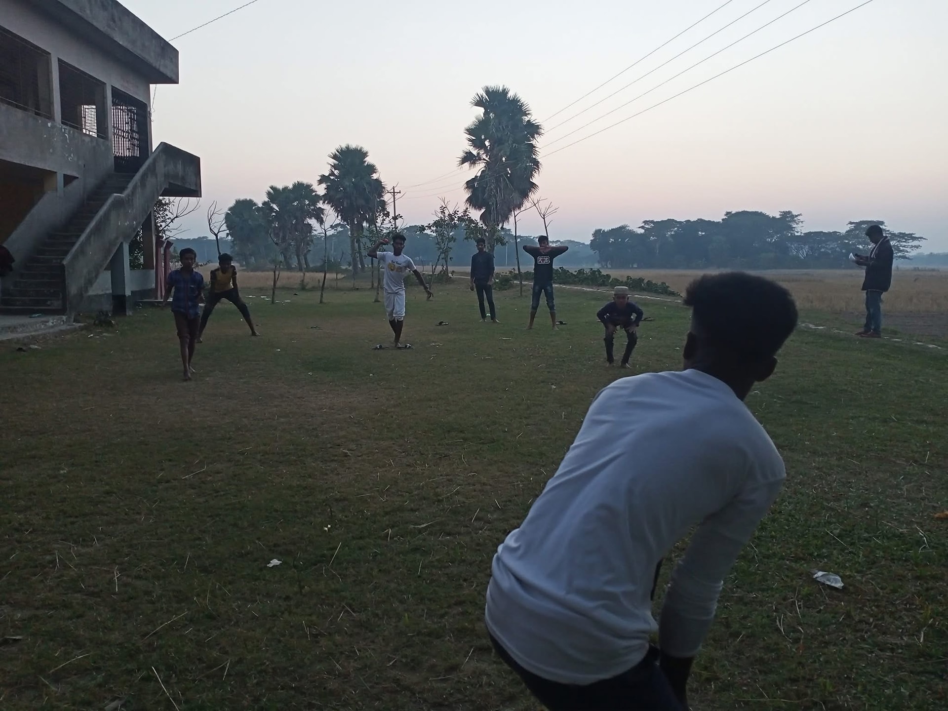 People playing football on an open field
